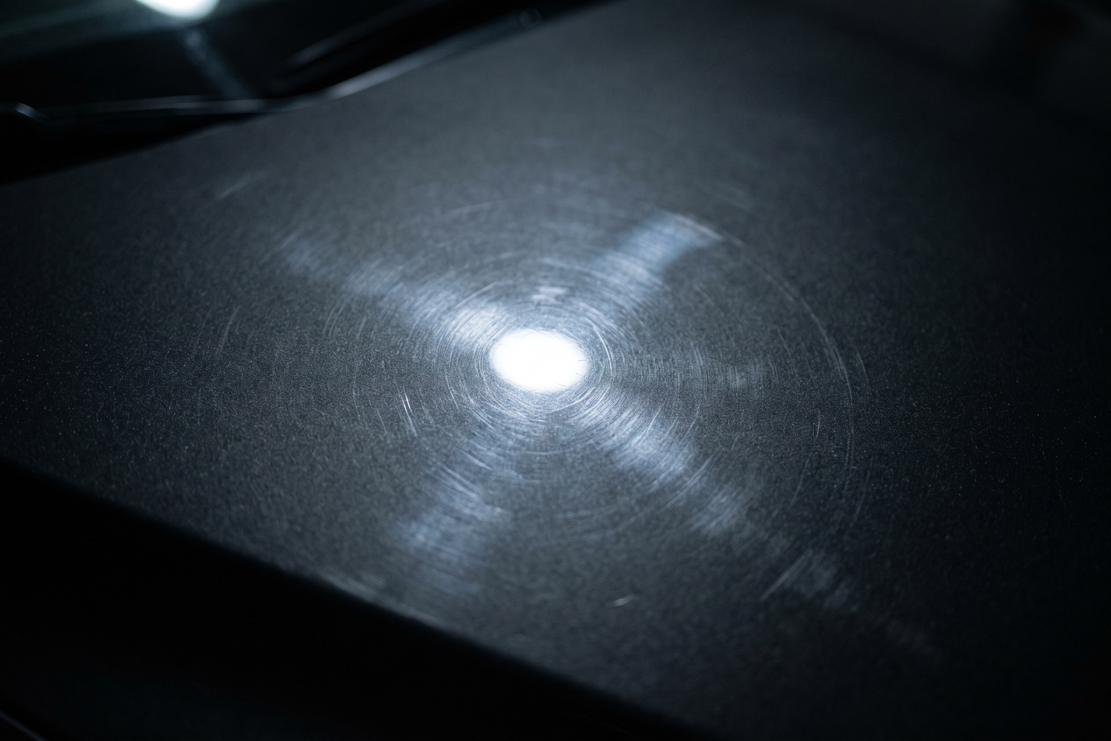 Before T-Shield — paint swirls and damage visible